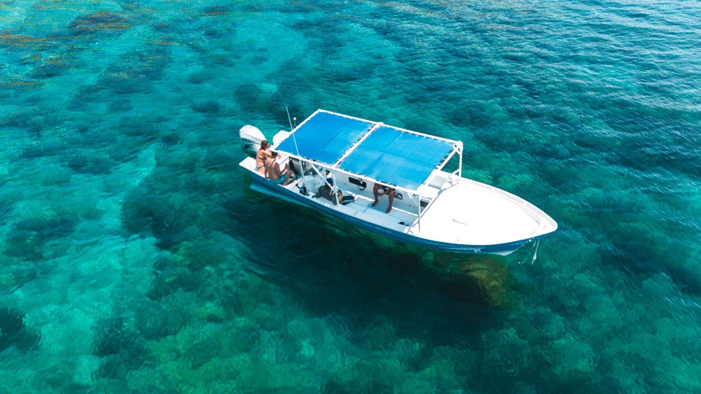 Boat over coral reef, Sea Safari Norte, La Paz